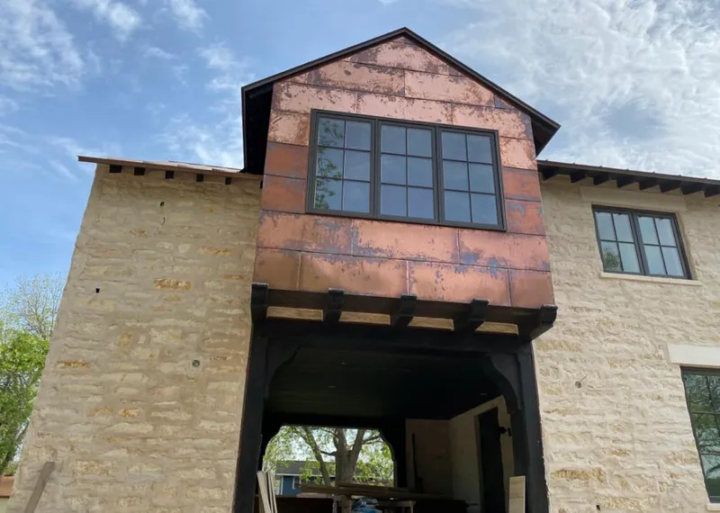 Copper metal panel facade on a stone building for Metal Roof Coating in Kula