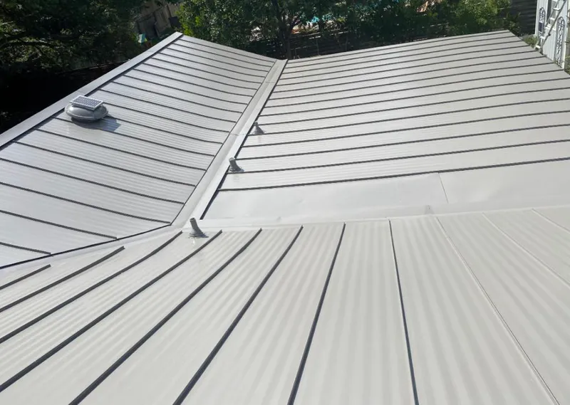 Solar attic fan installed on a metal roof for Roof Ventilation in Kula
